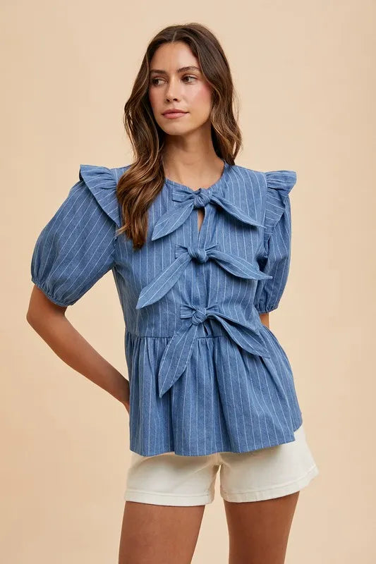 Annie Wear Stripe Front Bow Denim Peplum Blouse by Trendsi