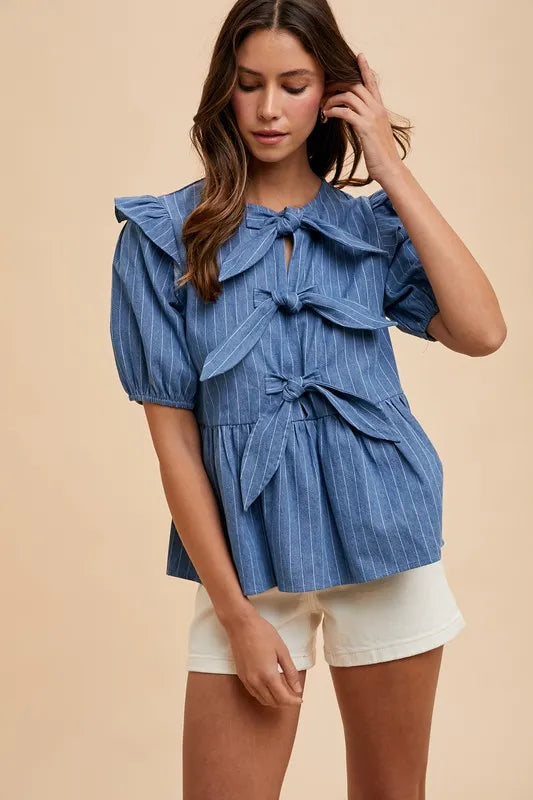 Annie Wear Stripe Front Bow Denim Peplum Blouse by Trendsi